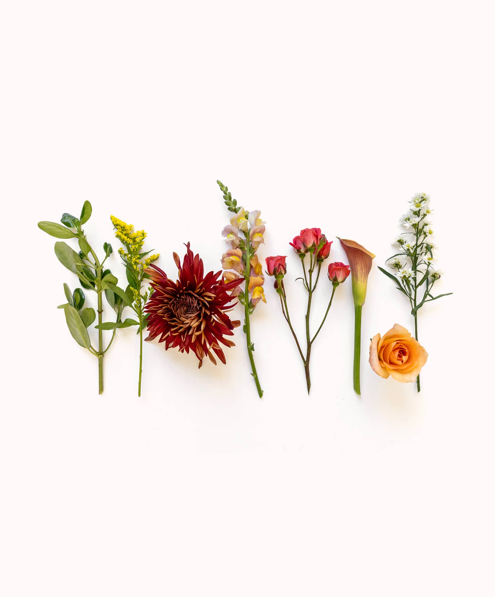 Colorful floral arrangement with assorted blooms and greenery for vibrant decor.